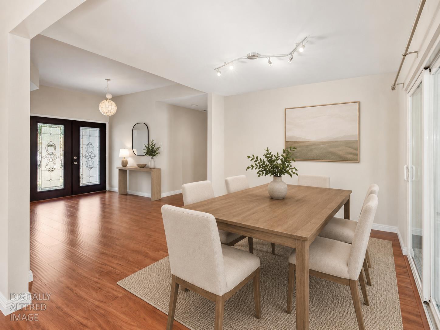 1540 Gregory Way Carmichael, CA 95608 - Photo 7 of 76 a view of a dining room with furniture and wooden floor