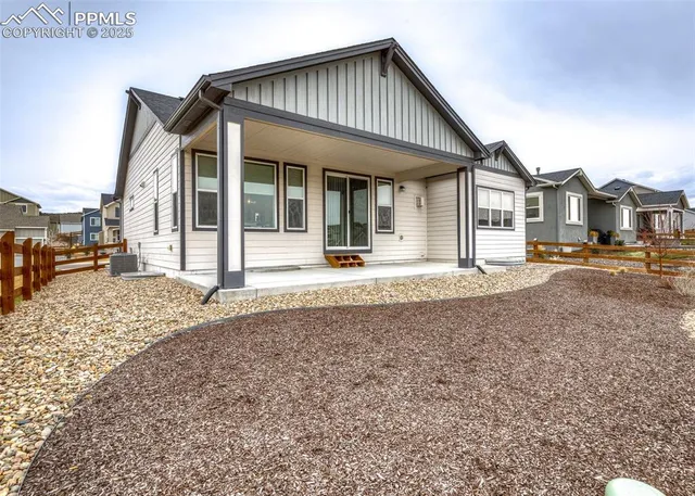 an aerial view of residential houses and outdoor space
