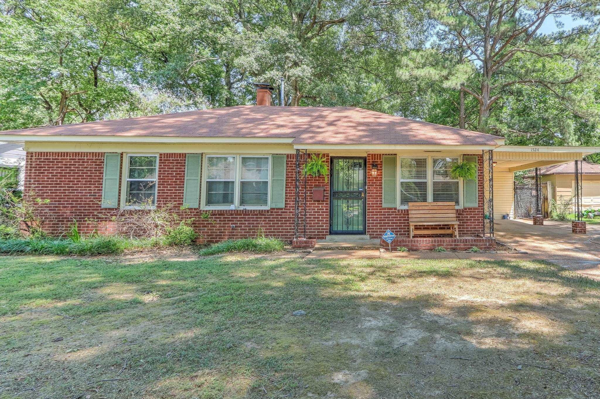 1524 Flamingo Road Memphis, TN 38117 - Photo 1 of 20 a backyard of a house with yard table and chairs