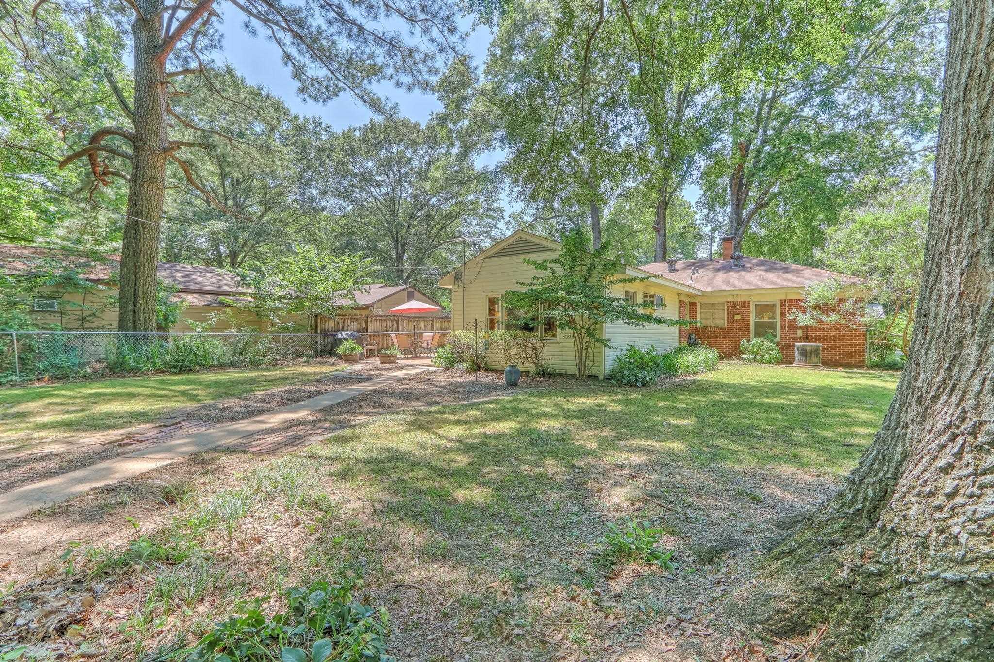 1524 Flamingo Road Memphis, TN 38117 - Photo 19 of 20 a front view of a house with a yard and trees
