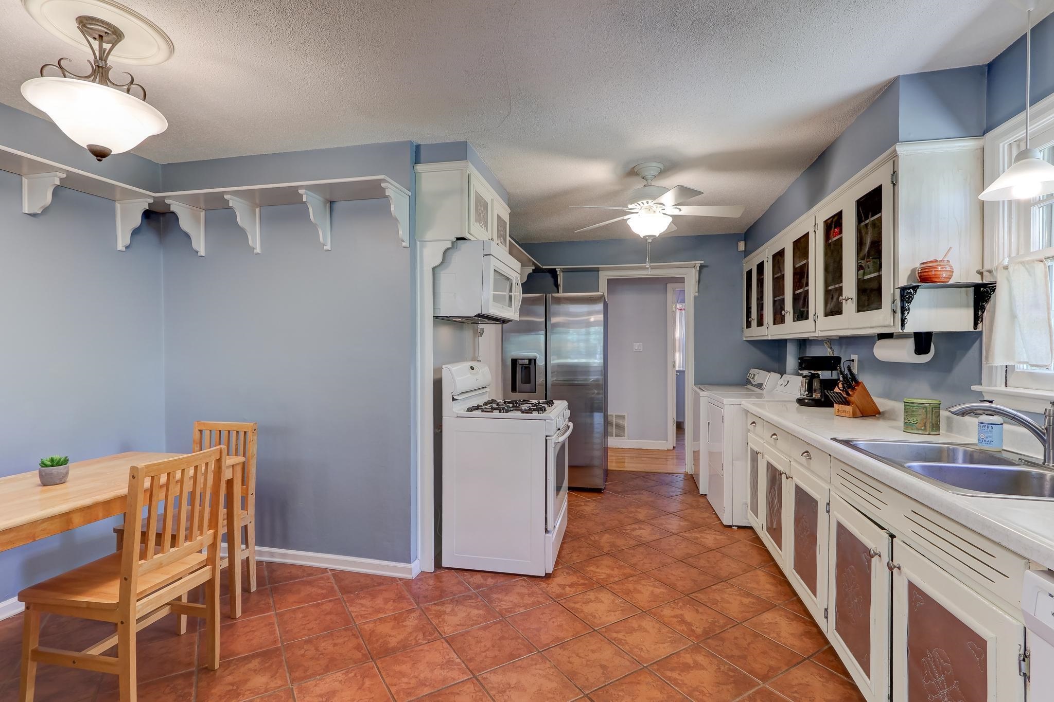1524 Flamingo Road Memphis, TN 38117 - Photo 6 of 20 a kitchen with stainless steel appliances granite countertop a sink and cabinets