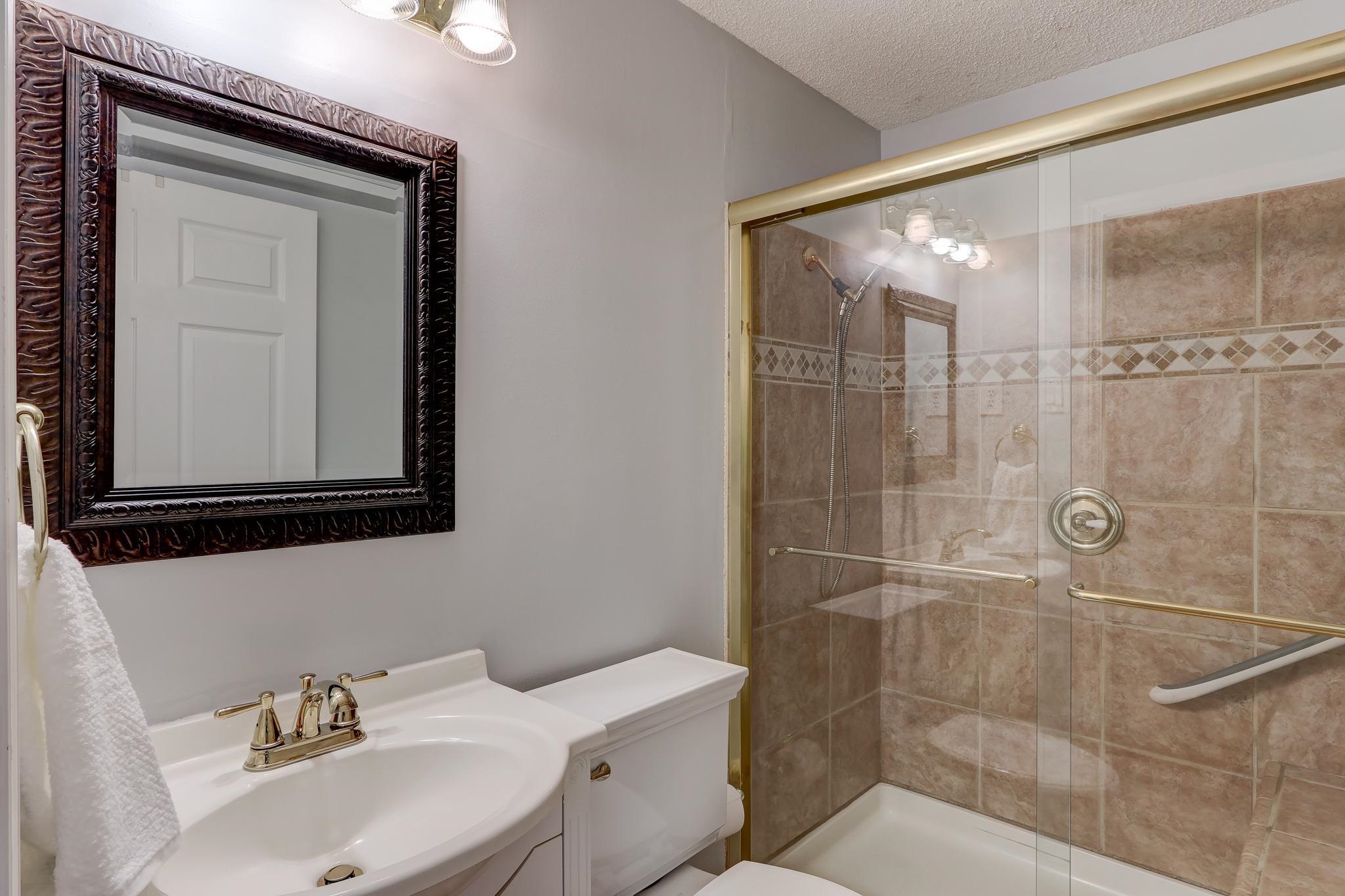 1524 Flamingo Road Memphis, TN 38117 - Photo 8 of 20 a bathroom with a sink toilet and shower
