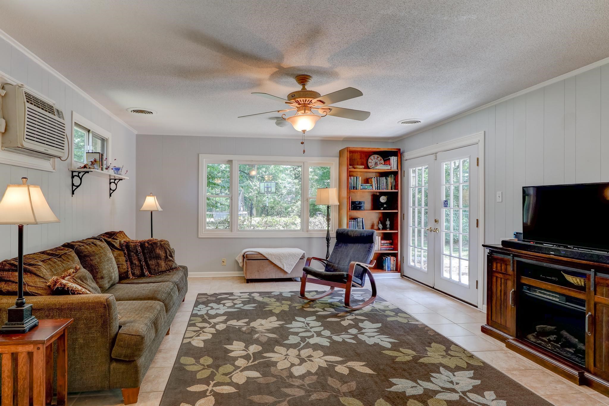 1524 Flamingo Road Memphis, TN 38117 - Photo 10 of 20 a living room with furniture a flat screen tv and a fireplace