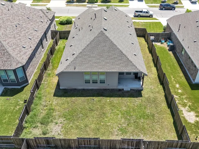 swimming pool view with a garden