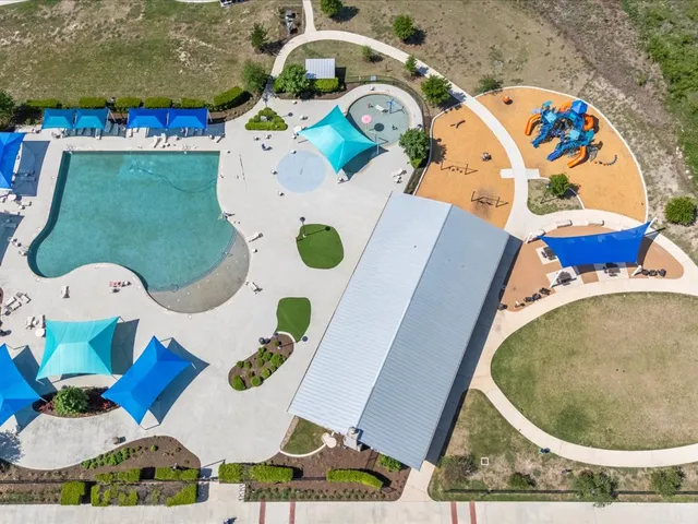 an aerial view of a house outdoor space swimming pool patio and outdoor seating