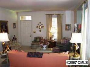 3200 Sharon Road, Unit 1 Charlotte, NC 28211 - Photo 3 of 8 a living room with furniture and a fireplace
