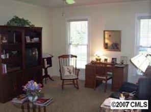3200 Sharon Road, Unit 1 Charlotte, NC 28211 - Photo 4 of 8 a living room with furniture and wooden floor