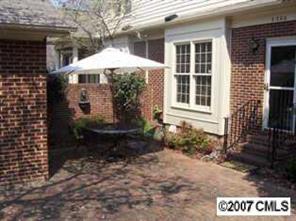 3200 Sharon Road, Unit 1 Charlotte, NC 28211 - Photo 7 of 8 a front view of a house with a yard