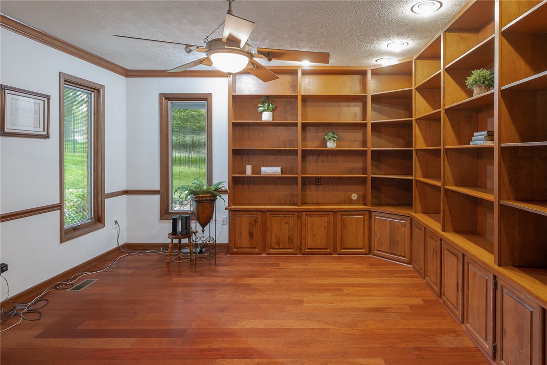 273 North Alpha Bellbrook Road Dayton, OH 45434 - Photo 9 of 43 This versatile room features beautiful hardwood floors and custom built-in shelving, perfect for a home office or library.