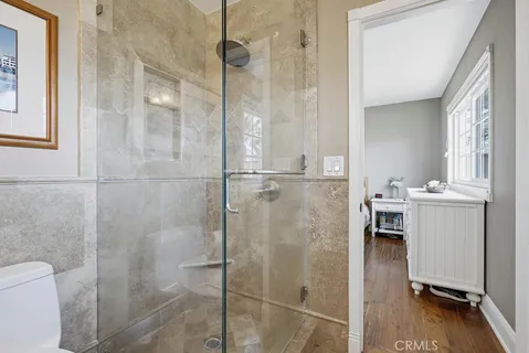 a bathroom with a shower and a toilet
