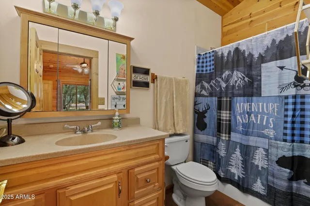 a bedroom with a bed and flat screen tv