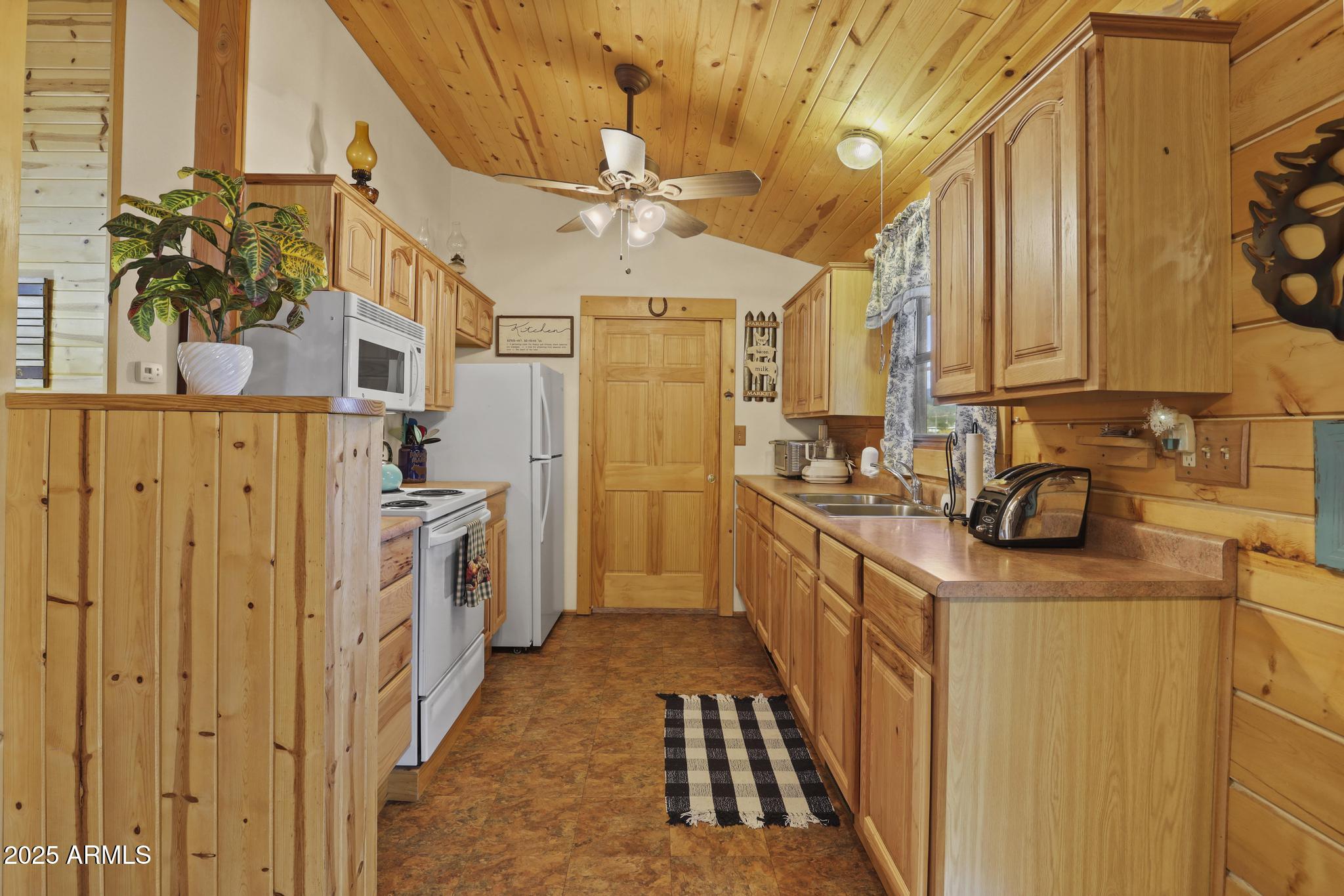 861 Palomino Way Payson, AZ 85541 - Photo 6 of 27 a kitchen with cabinets a sink and wooden floor