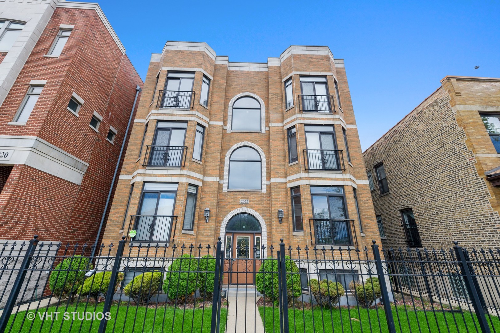 2022 North Wood Street, Unit 3S Chicago, IL 60614 - Photo 1 of 13 front view of a brick house with a door