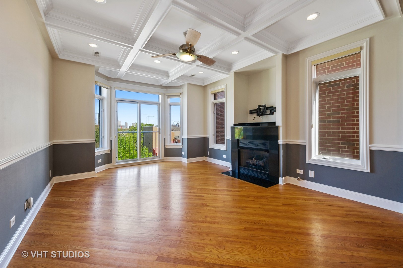 2022 North Wood Street, Unit 3S Chicago, IL 60614 - Photo 2 of 13 a large hall with wooden floor and a fireplace