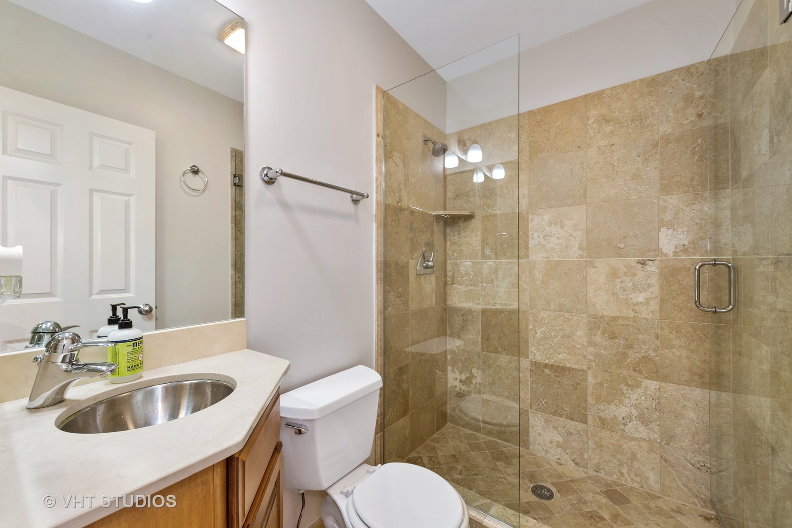2022 North Wood Street, Unit 3S Chicago, IL 60614 - Photo 11 of 13 a bathroom with a sink a toilet and shower