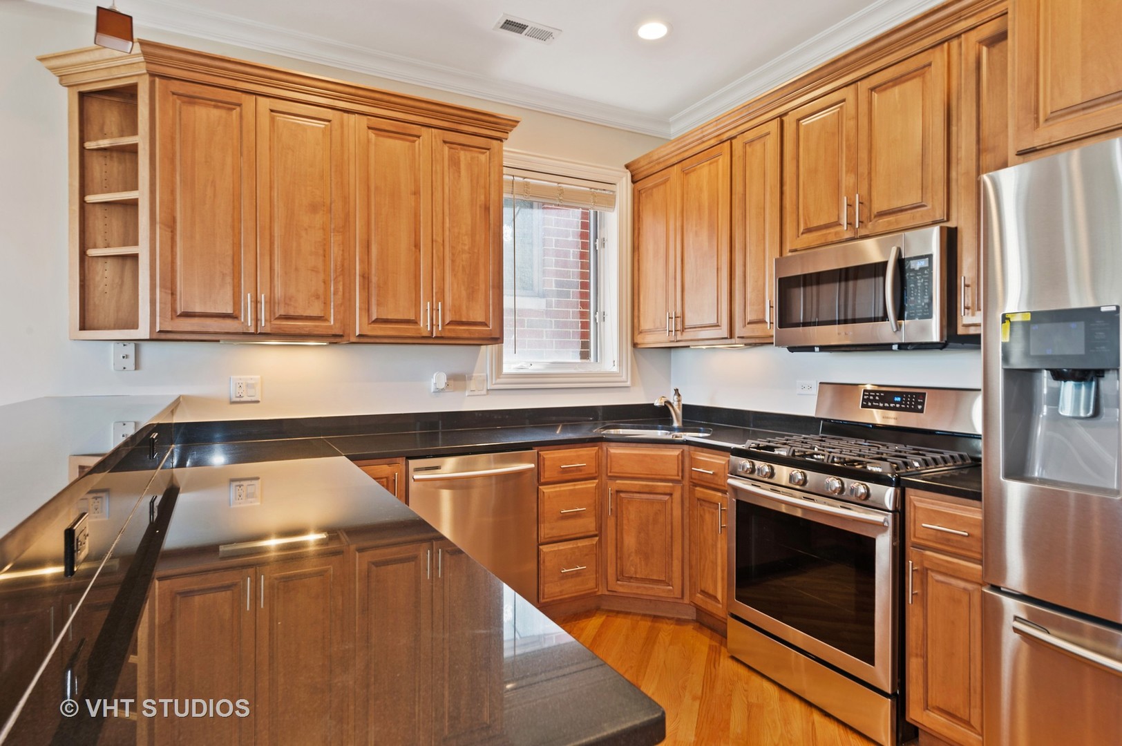 2022 North Wood Street, Unit 3S Chicago, IL 60614 - Photo 5 of 13 a kitchen with stainless steel appliances granite countertop a stove a sink and a microwave
