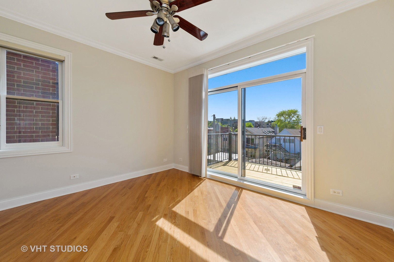 2022 North Wood Street, Unit 3S Chicago, IL 60614 - Photo 6 of 13 a view of an empty room with wooden floor and a window