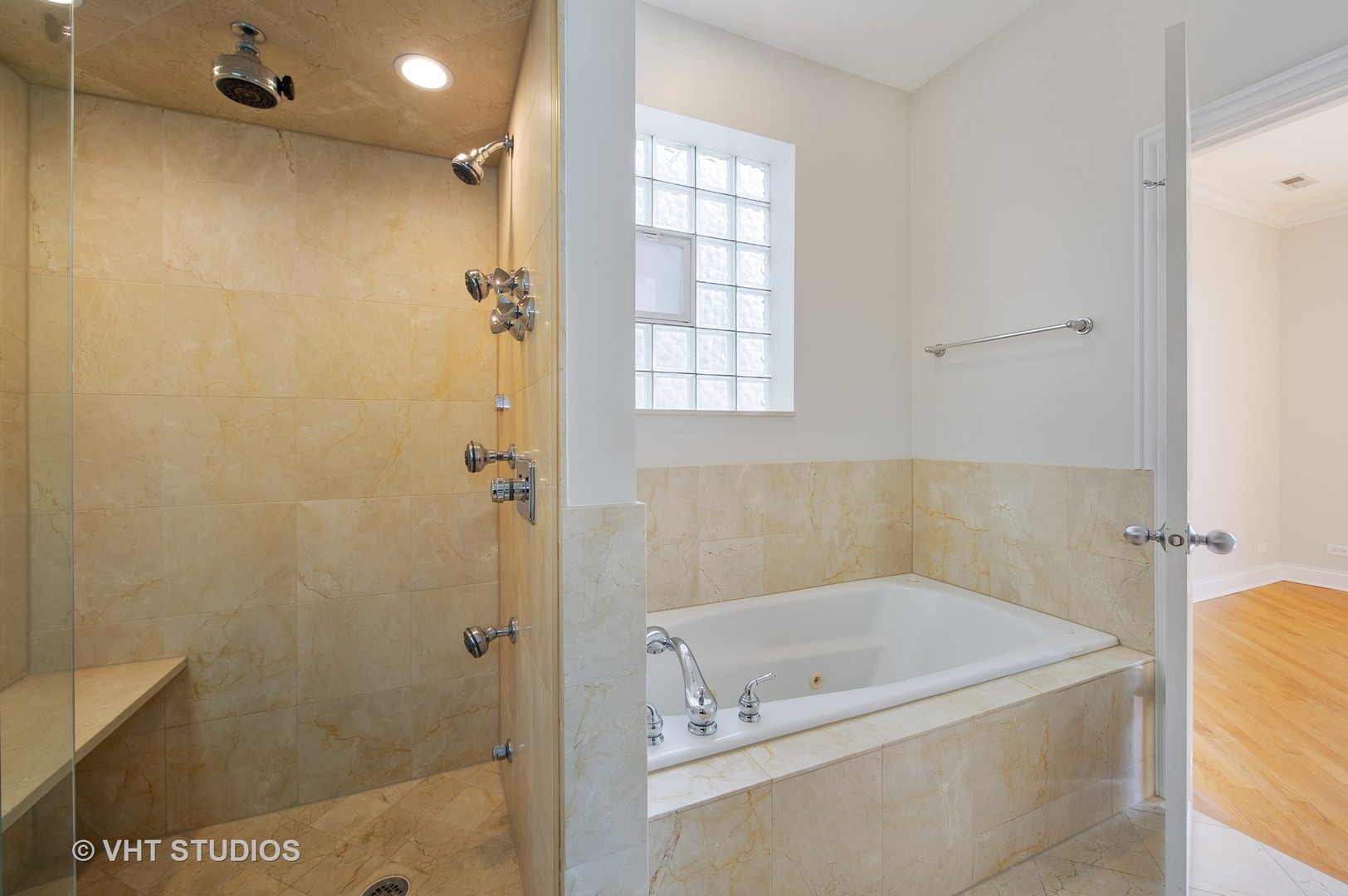 2022 North Wood Street, Unit 3S Chicago, IL 60614 - Photo 9 of 13 a bathroom with a tub a window and a shower
