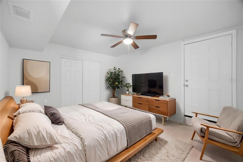 6629 Sierra Terrace New Port Richey, FL 34652 - Photo 8 of 30 a bedroom with a bed and a flat screen tv