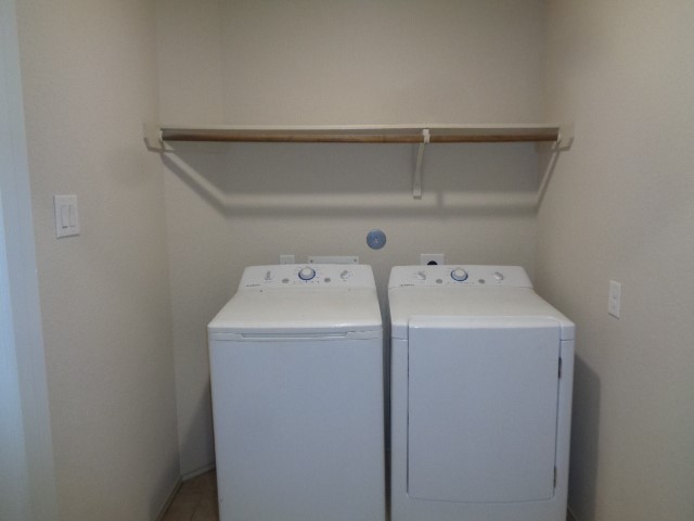 23314 Brat Pass Drive Spring, TX 77373 - Photo 19 of 20 a utility room with dryer and washer