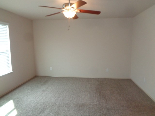 23314 Brat Pass Drive Spring, TX 77373 - Photo 7 of 20 an empty room with a chandelier fan