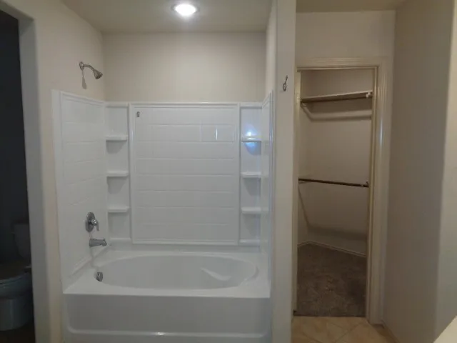 a close view of a bathtub in bathroom