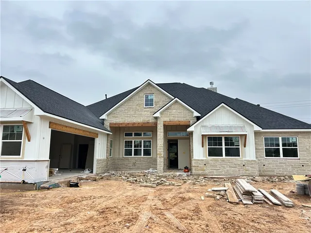a view of a house with snow in the background