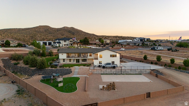 2591 East Washington Dam Road Washington, UT 84780 - Photo 51 of 67 Expansive property featuring a two-story residence with multiple balconies and a large fenced yard