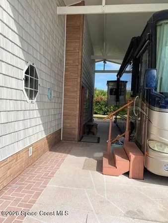 a view of a chairs and table in the patio