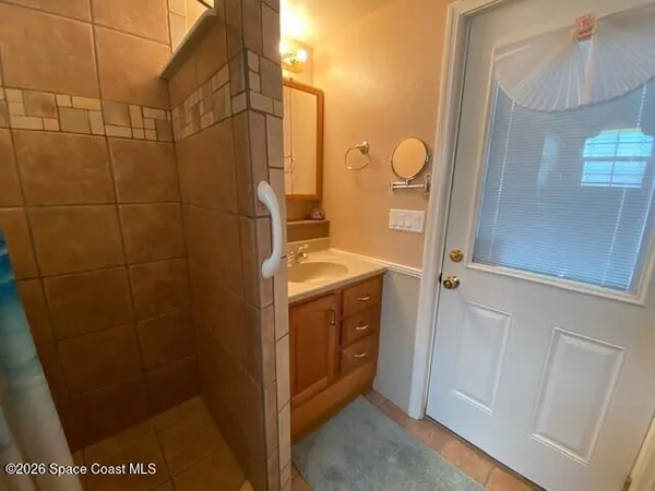 a bathroom with a sink and mirror