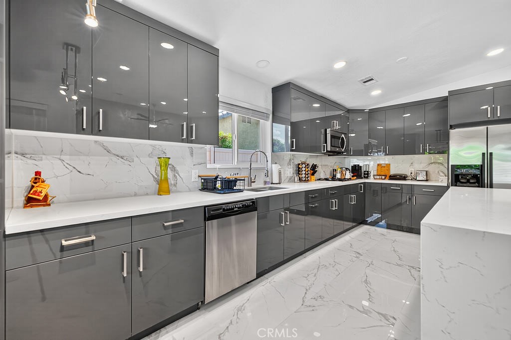 68830 Jarana Road Cathedral City, CA 92234 - Photo 12 of 28 a kitchen with counter top space cabinets and appliances
