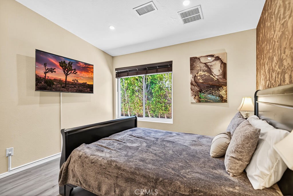 68830 Jarana Road Cathedral City, CA 92234 - Photo 16 of 28 a bed sitting in a bedroom next to a window