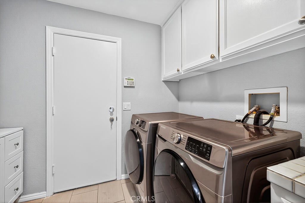 68830 Jarana Road Cathedral City, CA 92234 - Photo 19 of 28 a utility room with dryer and washer