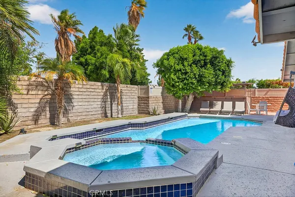 a view of a swimming pool with a patio