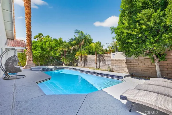 a view of a swimming pool with a patio