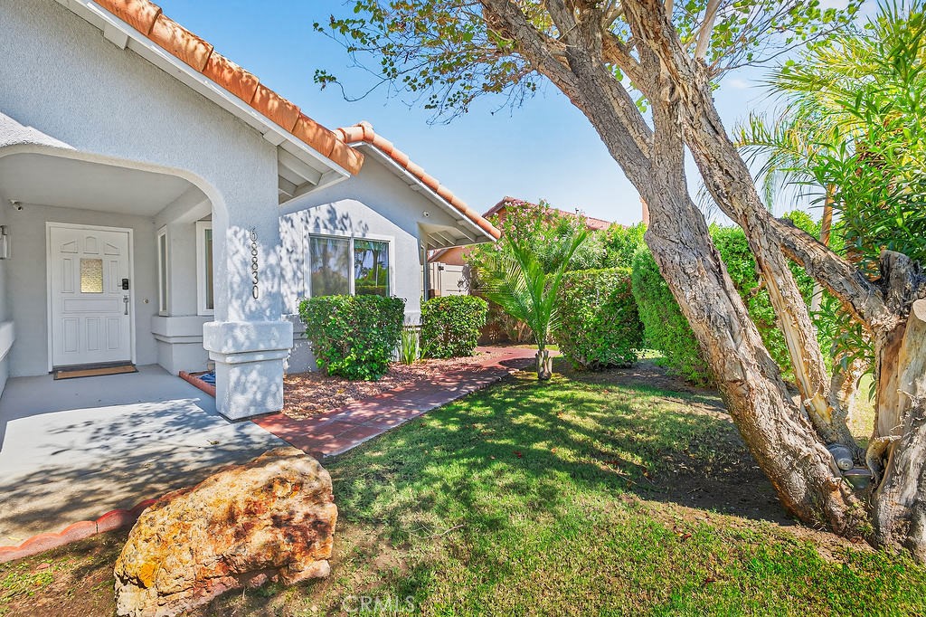 68830 Jarana Road Cathedral City, CA 92234 - Photo 27 of 28 a front view of a house with a yard