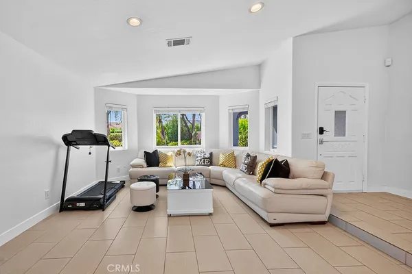 a living room with furniture and a large window