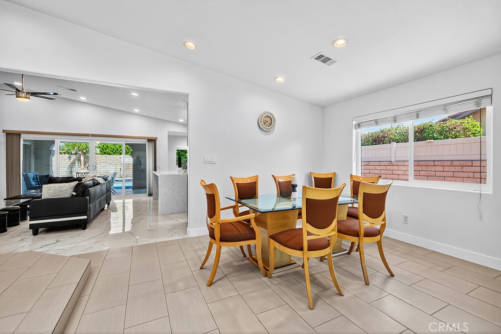 68830 Jarana Road Cathedral City, CA 92234 - Photo 7 of 28 a dining room with furniture and a large window