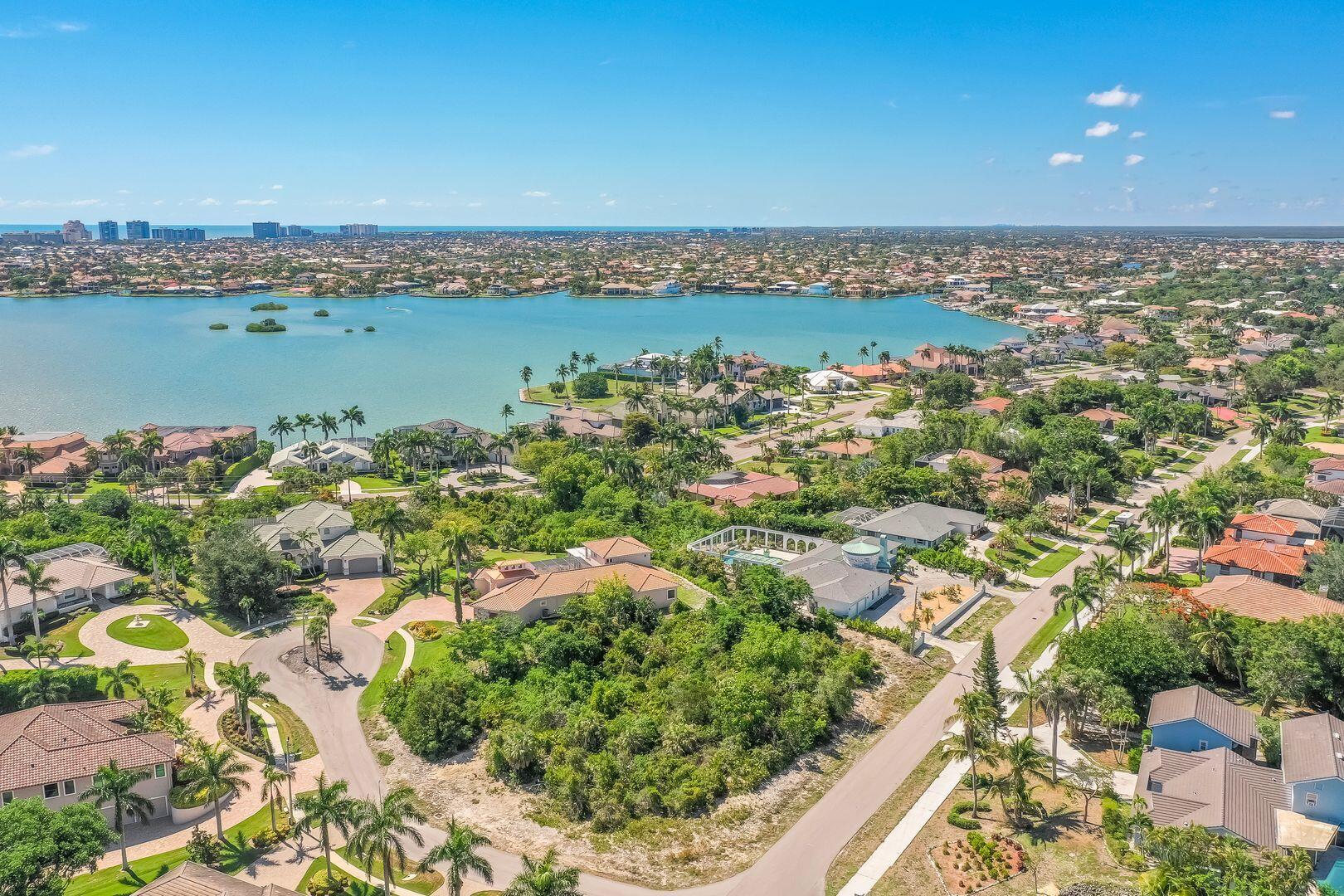 790 Inlet Drive Marco Island, FL 34145 - Photo 3 of 14 an aerial view of a city with lots of residential buildings and ocean view in back