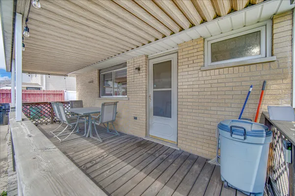 a patio with table and chairs