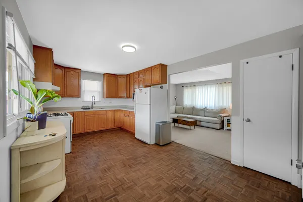 a kitchen with a sink cabinets and appliances
