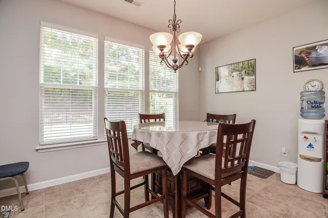a bathroom with a bathtub sink and window
