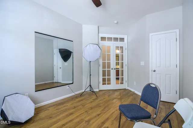 a bedroom with a bed a couch and dresser