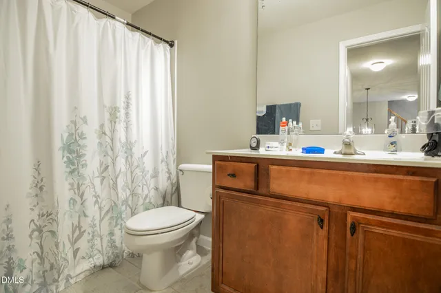 an aerial view of a house with a yard and pool
