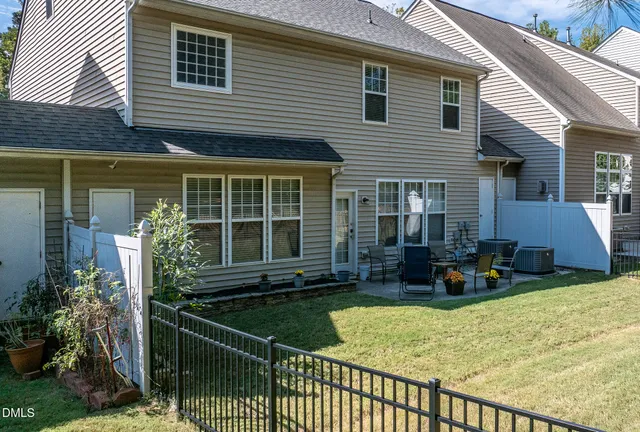 a backyard of a house with outdoor seating