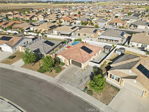 an aerial view of a house with a garden