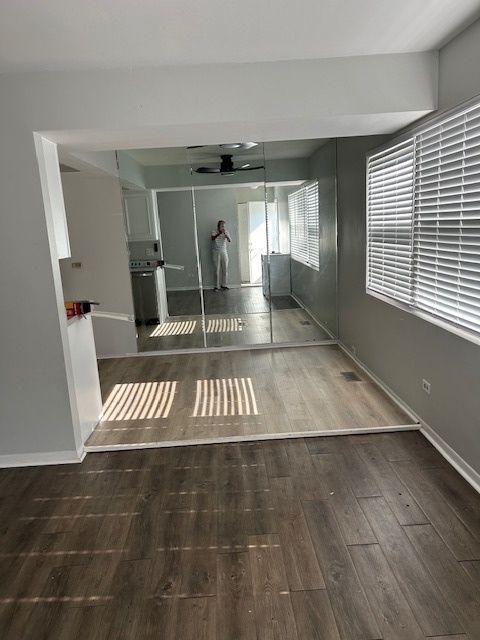 2186 North Oakbrook Circle, Unit 2186 Palatine, IL 60074 - Photo 4 of 11 a view of entryway and hall with wooden floor