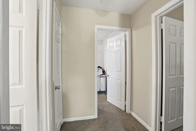 a bathroom with a sink a toilet and a window