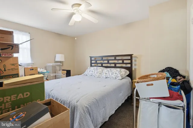 a bedroom with furniture and a chandelier