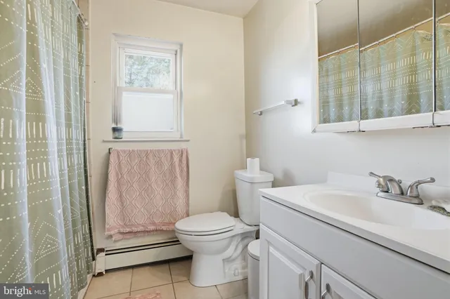 a bedroom with furniture and a book shelf